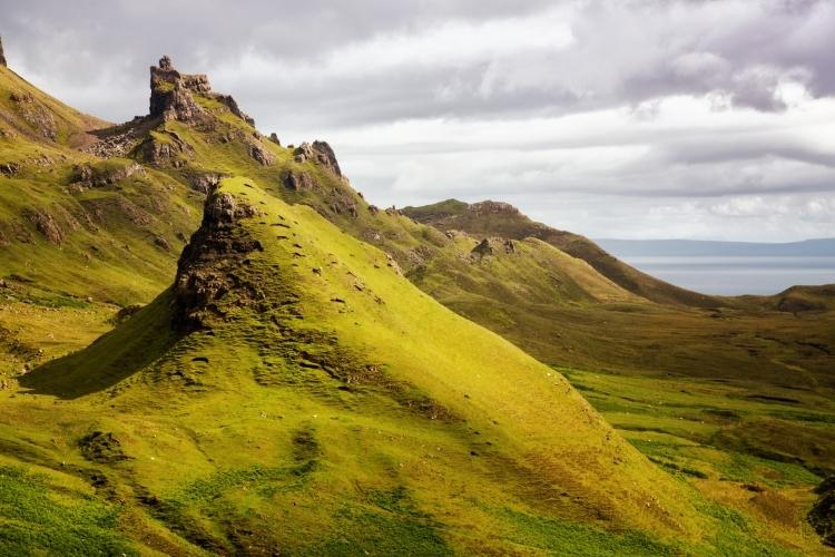 The whole of the Trotternish Ridge was formed by a great series of landslips, and is very popular for walks and bike rides. The name Quiraing comes from Old Norse ‘Kví Rand’, which means “Round Fold”. Within the fold is The Table, an elevated plateau hidden amongst the pillars. It is said that the fold was used to conceal cattle from Viking raiders. This stunning area has been used as a backdrop in many films.